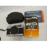 A Mamiya 135EE 35mm camera with instructions and case