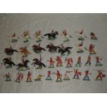 A selection of Britain's plastic Red Indian figures with metal bases including 15 Indians on