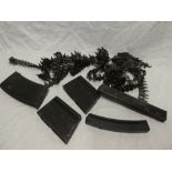 A selection of various magazines including MG13, Sten, empty machine gun belts,