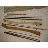 A vintage brass mounted bamboo three piece freshwater fishing rod;