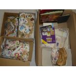 A large box containing various GB and World stamps on paper, albums of stamps, boxes, catalogues,