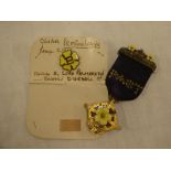 A gilt and enamelled Primrose League Special Service 1889 medal with lapel badge