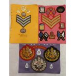 A Royal Military Academy Sandhurst shoulder title and Queens Crown badges, embroidered arm badges,