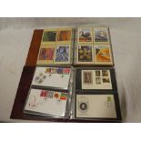 An album containing a selection of 60 GB first day covers and one other album of approximately 150
