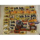 A selection of various boxed diecast vehicles including four Matchbox Models of Yesteryear