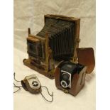 A brass mounted mahogany folding plate camera by Thornton Pickard (minus lens) and a Ross Ensign