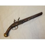 A late 18th/early 19th Century flintlock holster pistol with 10" steel barrel,
