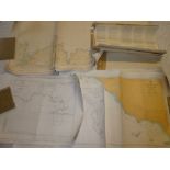 A large selection of various modern nautical charts and navigation maps