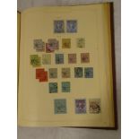 A folder album containing a good collection of Mauritius stamps,