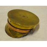 A large First War trench art Officer's copper and brass cap made from a 1917 4.