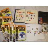 A SG 2009 Stamps of the World catalogue in five volumes, two Royal Mail yearbooks, football stamps,