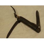 An old military/Naval issue jack knife with original leather suspension strap