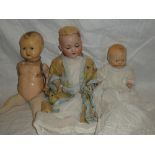 A child's porcelain headed baby doll by Armand Marseille of Germany marked "A.