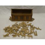 An old wooden Noah's Ark figure containing a selection of various wooden animals