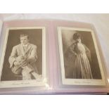 An album containing a collection of "Cinema Chat" postcards of actors and actresses 1919 onwards