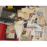 A box containing various cover albums, first day covers, postcards, stamps,