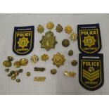 A brass South African Police Kings Crown helmet plate,