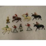 A selection of metal Cowboys and Indians on horseback,