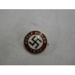 A German enamelled Adolf Hitler 1933 circular party badge