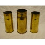 Three various brass First War trench art shell cases engraved with flowers and leaves