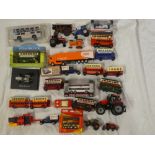 A selection of various diecast toys including tractors, buses, cars,