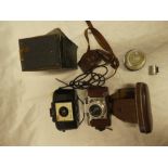 A Braun Paxette 35mm camera with case and accessories;