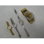 A gentlemans wristwatch by Swatch and three various ladies wristwatches
