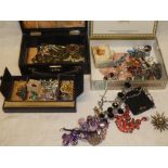 A jewellery box and wooden box containing a quantity of various costume jewellery