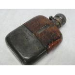 A good quality silver mounted glass hip flask with base cup and leather mounts,