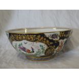 A good quality late 19th Century china circular bowl with painted panels of Oriental birds and