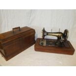 An old sewing machine by "Wettina Familiae" with cover and instruction book