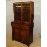 A 19th Century mahogany secretaire bookcase with internal pigeon holes and drawers enclosed by a