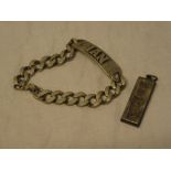 A silver rectangular ingot pendant and a silver ID bracelet with chain