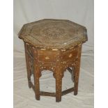 A Middle Eastern inlaid teak octagonal occasional table with bone and ebony floral decoration on