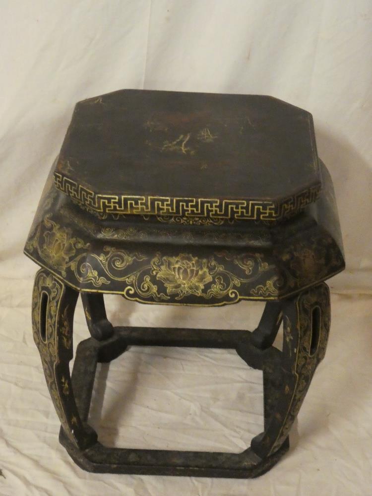 An old Eastern lacquered square jardiniere stand with gilt floral and scroll decoration,