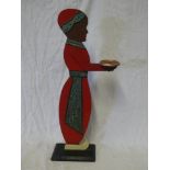 An old painted wood waiter stand in the form of a Middle Eastern figure,