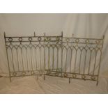 A pair of ornate aluminium railing panels with arched decoration,