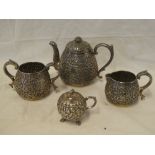A good quality Indian silver three-piece tea set comprising tapered teapot with raised scroll