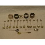 Four various silver napkin rings, a selection of filigree coffee spoons, silver thimble,