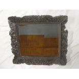 An unusual Chinese bevelled rectangular wall mirror in carved wood pierced frame decorated with