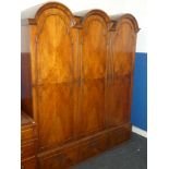 A 19th Century walnut chest-on-chest, the base with three long graduated drawers,