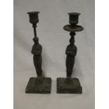 A pair of 19th Century bronze candlesticks,