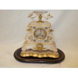 A 19th Century French gilt mounted marble mantel clock with circular dial in ornamental tapered