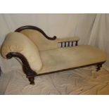 A Victorian mahogany chaise longue upholstered in draylon with turned supports on turned legs with