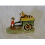 A Carltonware china Guinness advertising figure of a farmer pulling a cart with horse riding on top
