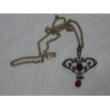 A 9ct gold chain link necklace supporting a pinchbeck Art Nouveau pendant set garnets