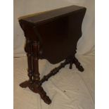 A Victorian mahogany oval drop leaf Sutherland-style tea table on turned supports and tapered feet