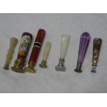 Seven various hand seals including amethyst, porcelain, bone,