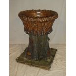 An unusual 19th Century salt glazed garden urn and stand modelled as a tree trunk,