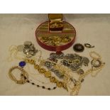 A selection of various costume jewellery including an Eastern enamelled silver pendant,